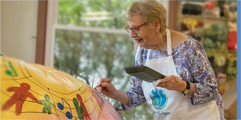 Jackie Brown partnered with Northwest Catholic High School students to create “Harmony” Bear for the WeHa Bear Fair to benefit the non-profit For All Ages.