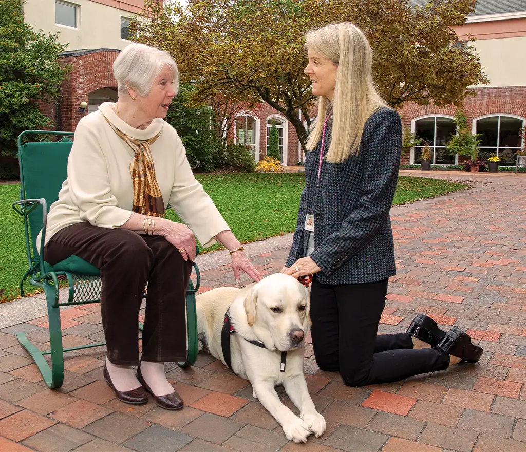 Residents petting a dog