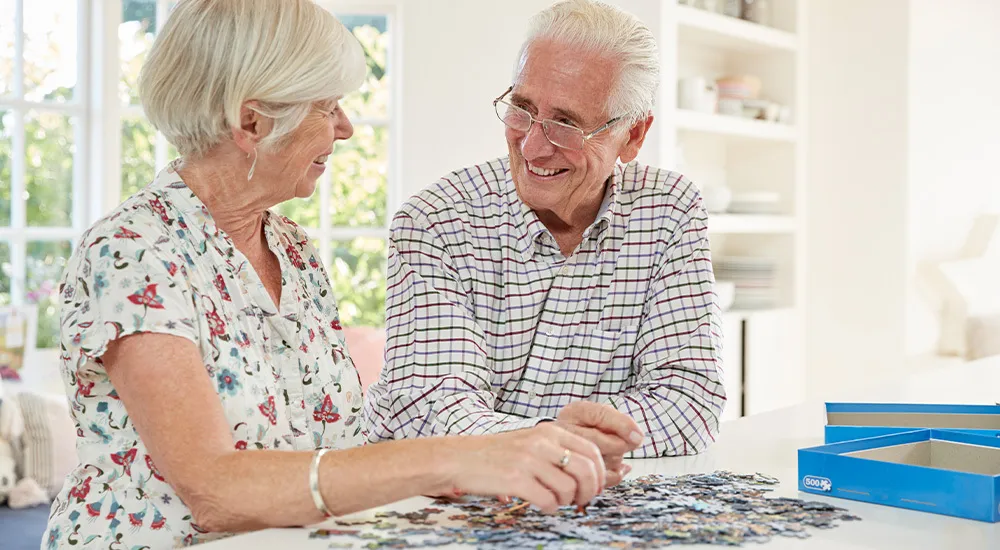 Couple solving a puzzle